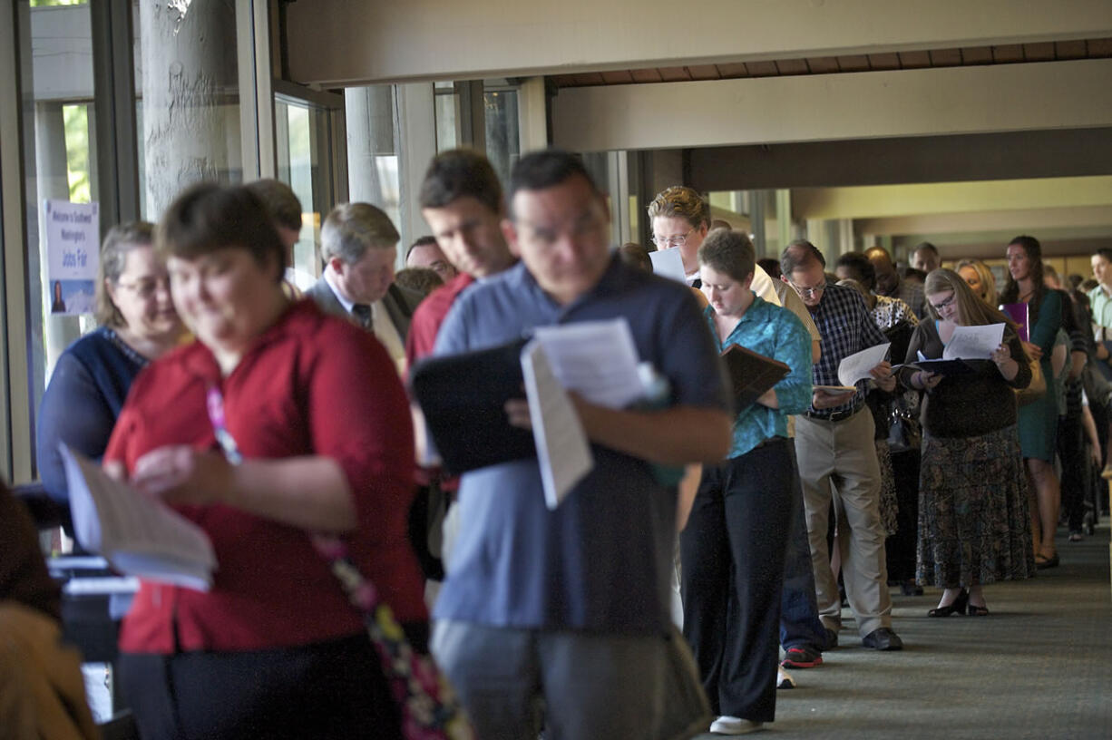 A long line of people wait to get in to a job fair hosted by Rep.