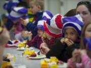 Harmony Elementary first-graders were treated to green eggs and ham and hats fashioned after Dr.