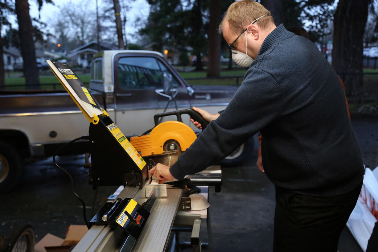 Esther Short: Jesse Harvey won an auction for a TigerStop SawGear automated stop at the Southwest Washington Contractor&#039;s Association holiday party, which raised more than $15,000 for the association&#039;s scholarship program.