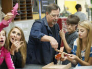 Now-retired View Ridge Middle School industrial arts teacher Kent Bennett works with, from left, Madison Campbell, Madison Harter, Brent Goff and Halle Sessions on June 1. High school graduation requirements have caught the eye of state Rep.