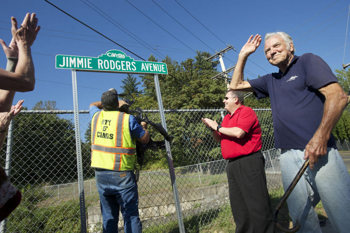 Pop singer and Camas native Jimmie Rodgers waves to the crowd during a street sign dedication ceremony Friday.