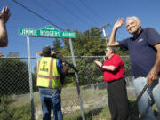 Pop singer and Camas native Jimmie Rodgers waves to the crowd during a street sign dedication ceremony Friday.