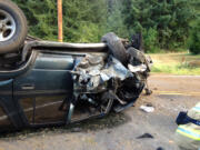 SCOTT SORENSON/Fire District 3
A Toyota 4Runner rolled onto its top near Battle Ground Thursday morning after crashing into a mailbox and a couple of trees along Northeast 244th Street.