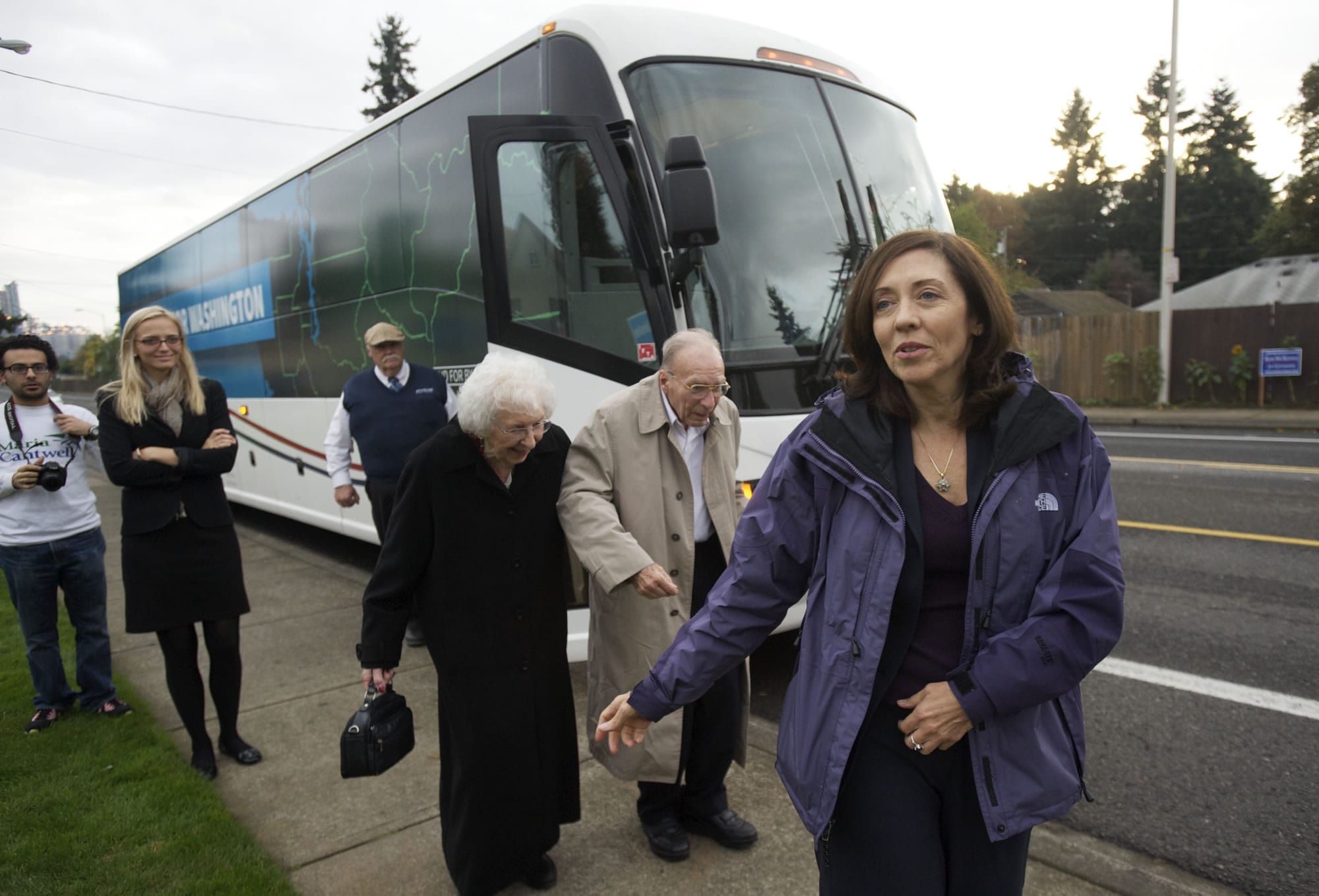 U.S. Sen. Maria Cantwell, D-Wash., makes a campaign stop at the Vancouver Firefighters Union Hall on Friday evening as former state Rep. Val Ogden and former Clark County Democratic Party Chairman Dan Ogden follow behind.