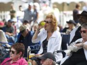 Gail Pritchett enjoys a drink Sunday at the 2013 Vancouver Wine and Jazz Festival in Esther Short Park.