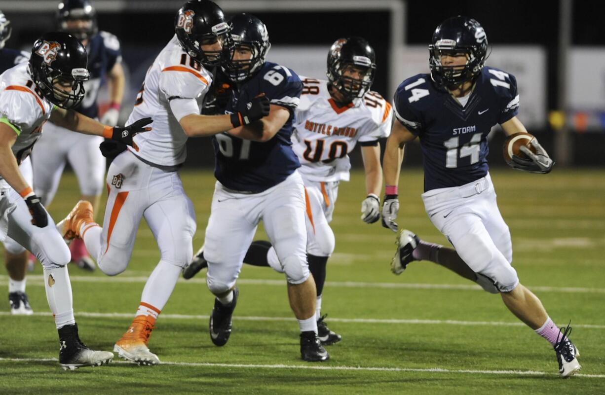 (Photo 1 of 8) Skyview's Dylan King (14) makes a run against Battle Ground during the first half Friday at Kiggins Bowl.