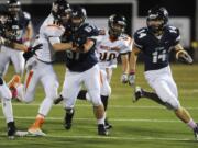 (Photo 1 of 8) Skyview's Dylan King (14) makes a run against Battle Ground during the first half Friday at Kiggins Bowl.