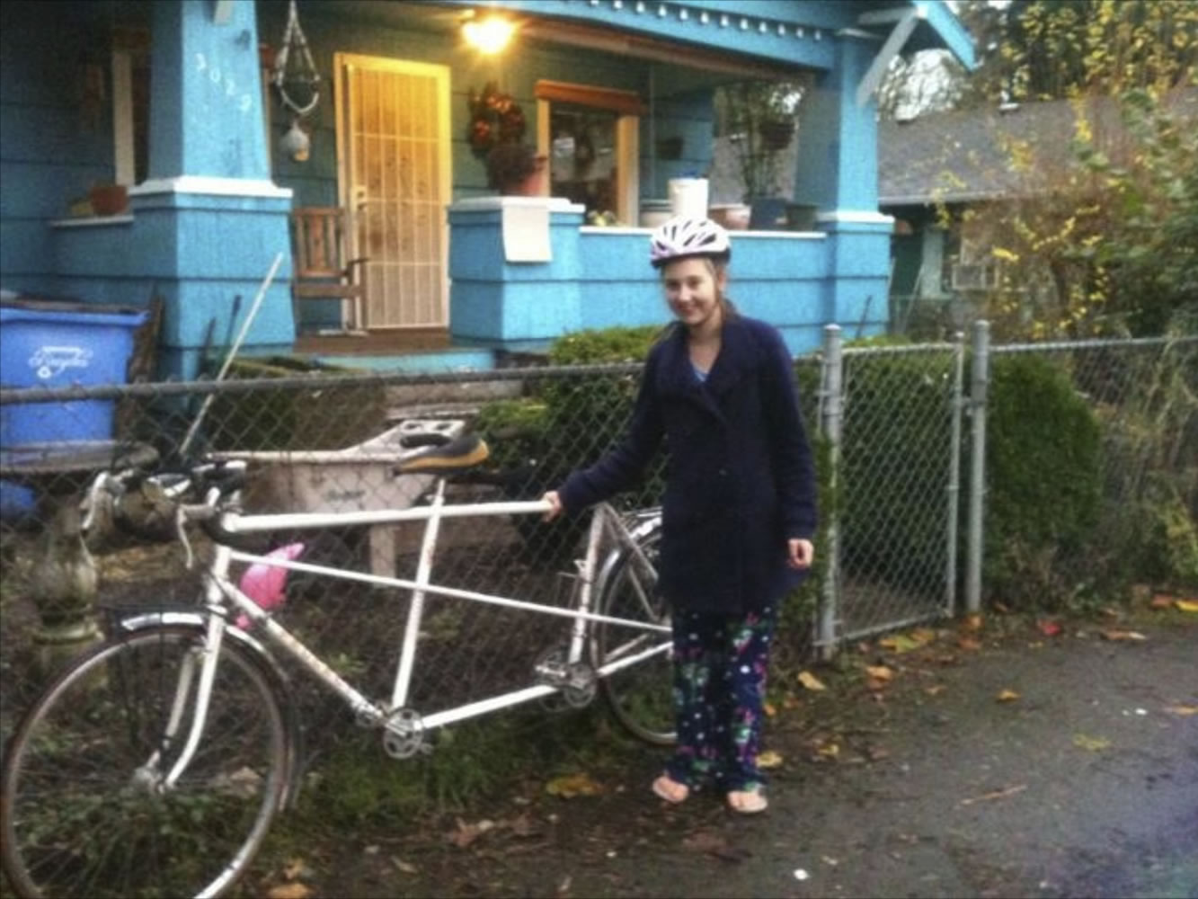 Courtney Forbes stands next to her tandem bicycle.