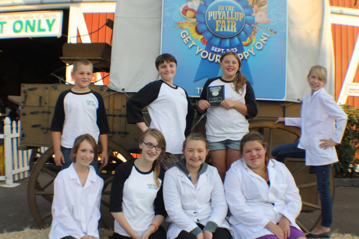 Brush Prairie: Prizewinning rabbit experts Hunter Coss (back row left), Emma Oster, Erin Marble, Autumn Richardson; and Tori Richardson (front row left), Lizi Jesser, Amanda Pereira and Jennifer Gusey.