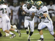 Evergreen's Robert Akil (4) had nine carries for 32 yards in the Plainsmen's come-from-behind-win over Prairie.