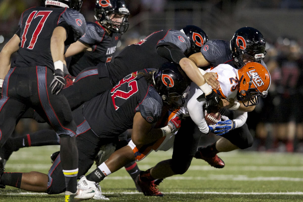 The Camas defense limited Pete Bostic (25) and Lakes to 8 yards of rushing in the first half and cruised to victory in the team's non-league finale.