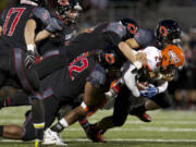 The Camas defense limited Pete Bostic (25) and Lakes to 8 yards of rushing in the first half and cruised to victory in the team's non-league finale.