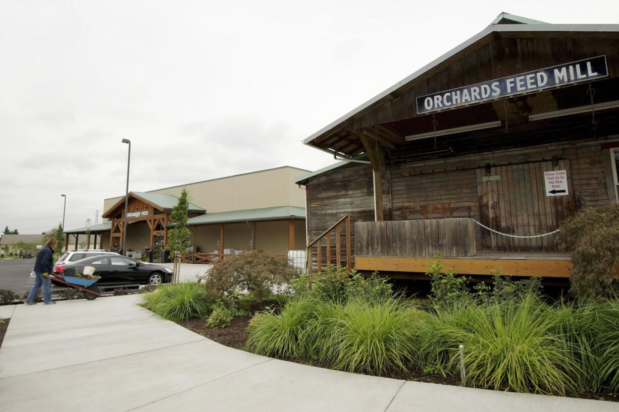 The old, right, and the new Orchards Feed store buildings on Covington Road in Orchards.