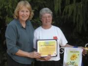 Shumway: Shumway Neighborhood Association Chairwoman Anne McEnerny-Ogle, left,  hands an award to resident  Linda Caton for her involvement in the neighborhood.