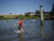 Devyn Thomas of Vancouver runs back to shore during a recent summer at Klineline Pond.