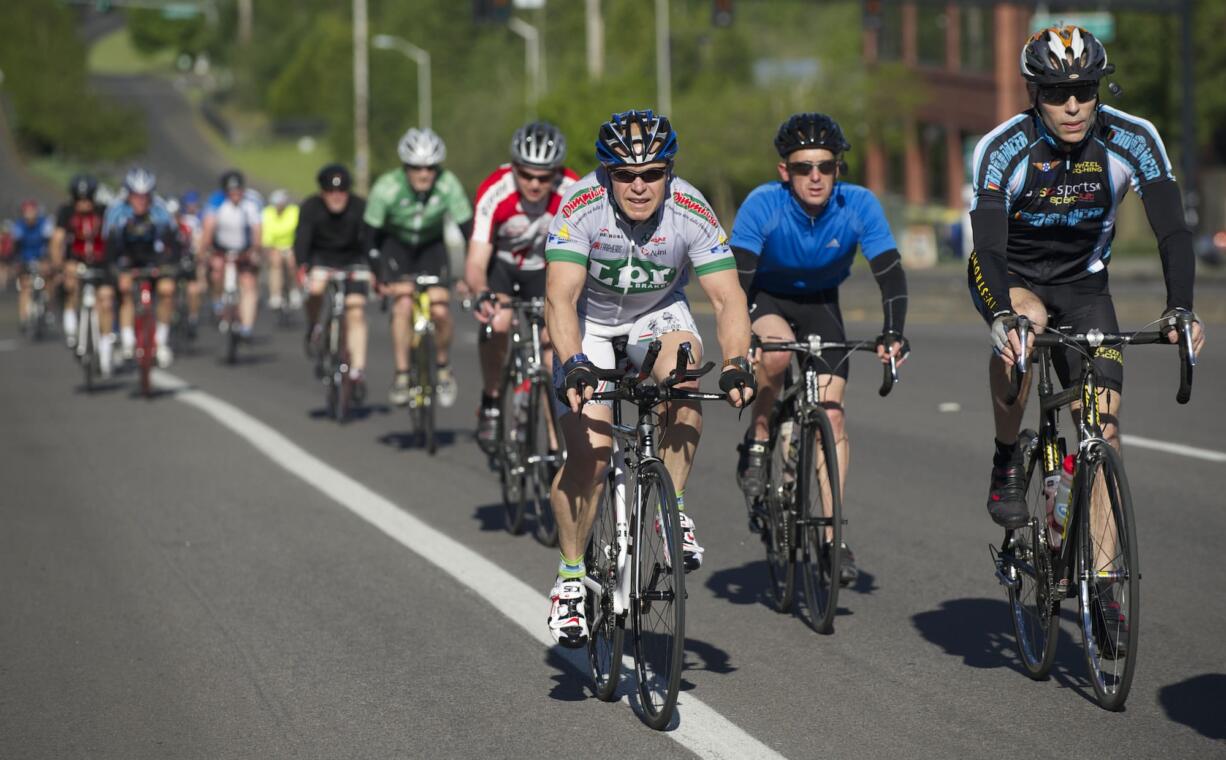 Cyclists make their way along Southeast 34th Street toward Lacamas Lake on Saturday during the Vancouver Bicycle Club's 30th Annual Ride Around Clark County.