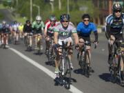 Cyclists make their way along Southeast 34th Street toward Lacamas Lake on Saturday during the Vancouver Bicycle Club's 30th Annual Ride Around Clark County.