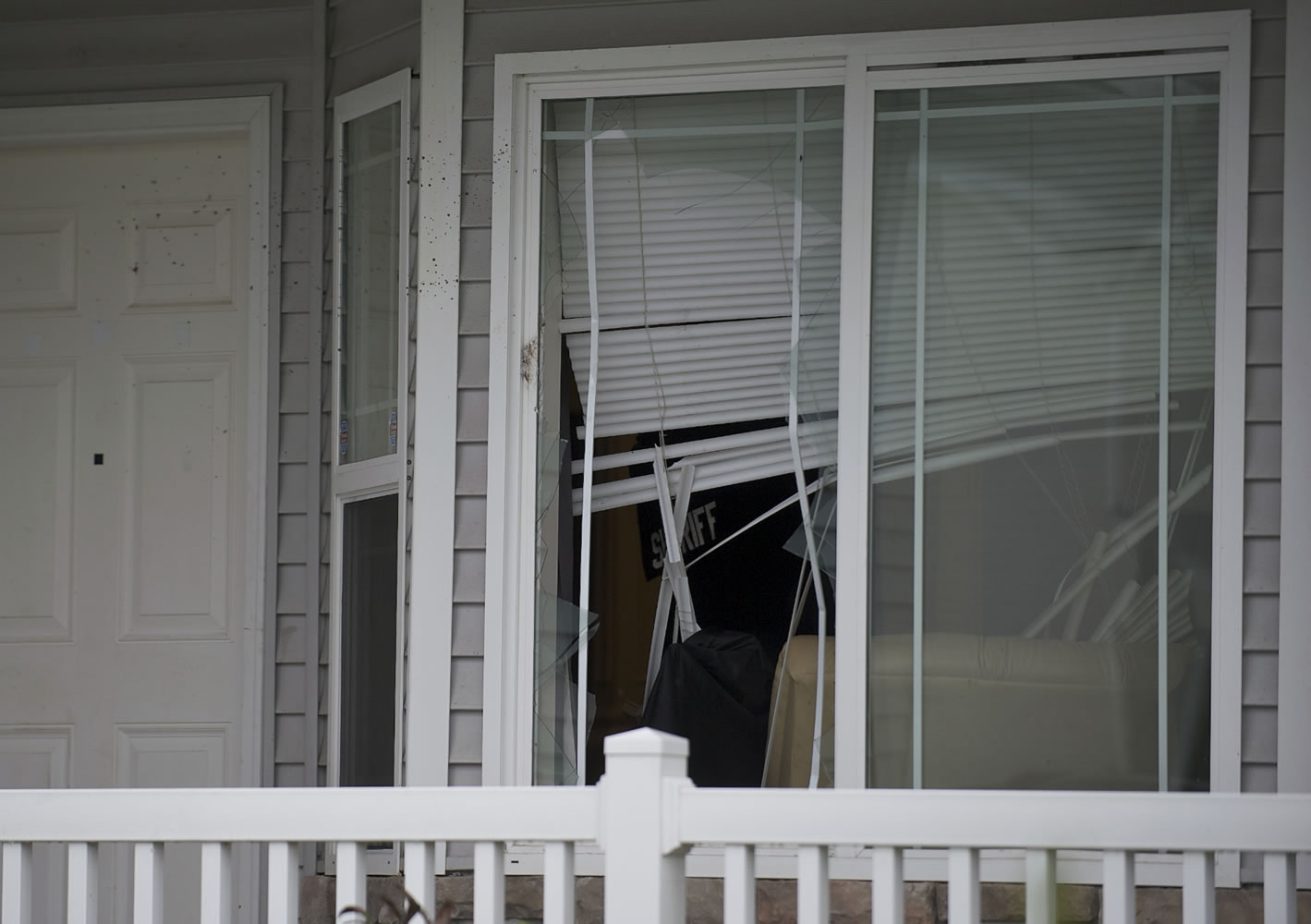 Neighbors said they heard glass breaking early Saturday morning in the Sunnyside neighborhood where Clark County sheriff's detectives say a fatal stabbing occurred.