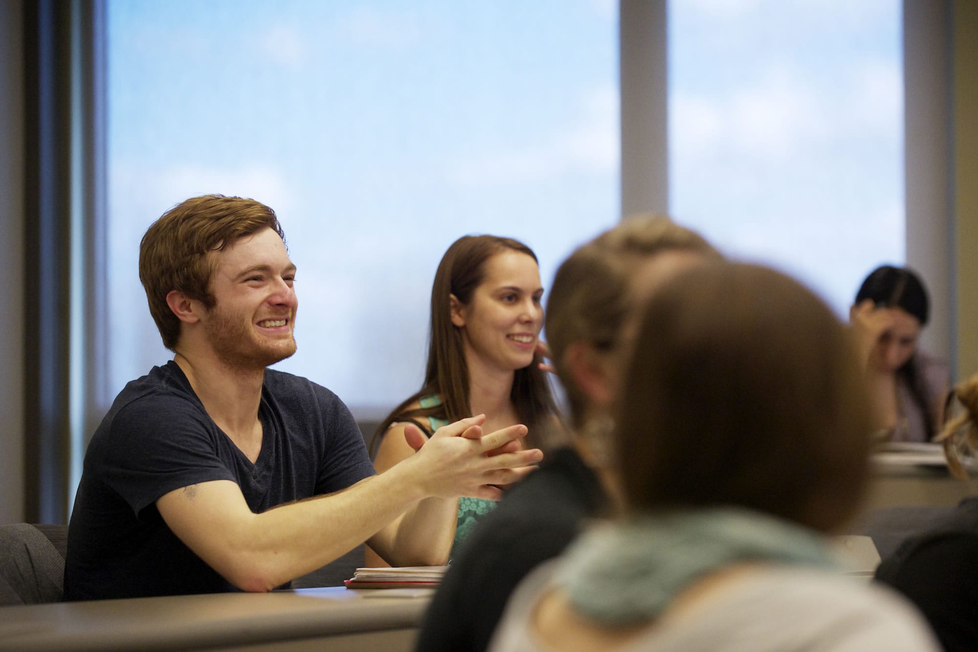 Tanner Roggenkamp, left, listens during a human development class at WSUV. Doctors and teachers said Roggenkamp probably would never learn how to read or write. He proved them wrong.