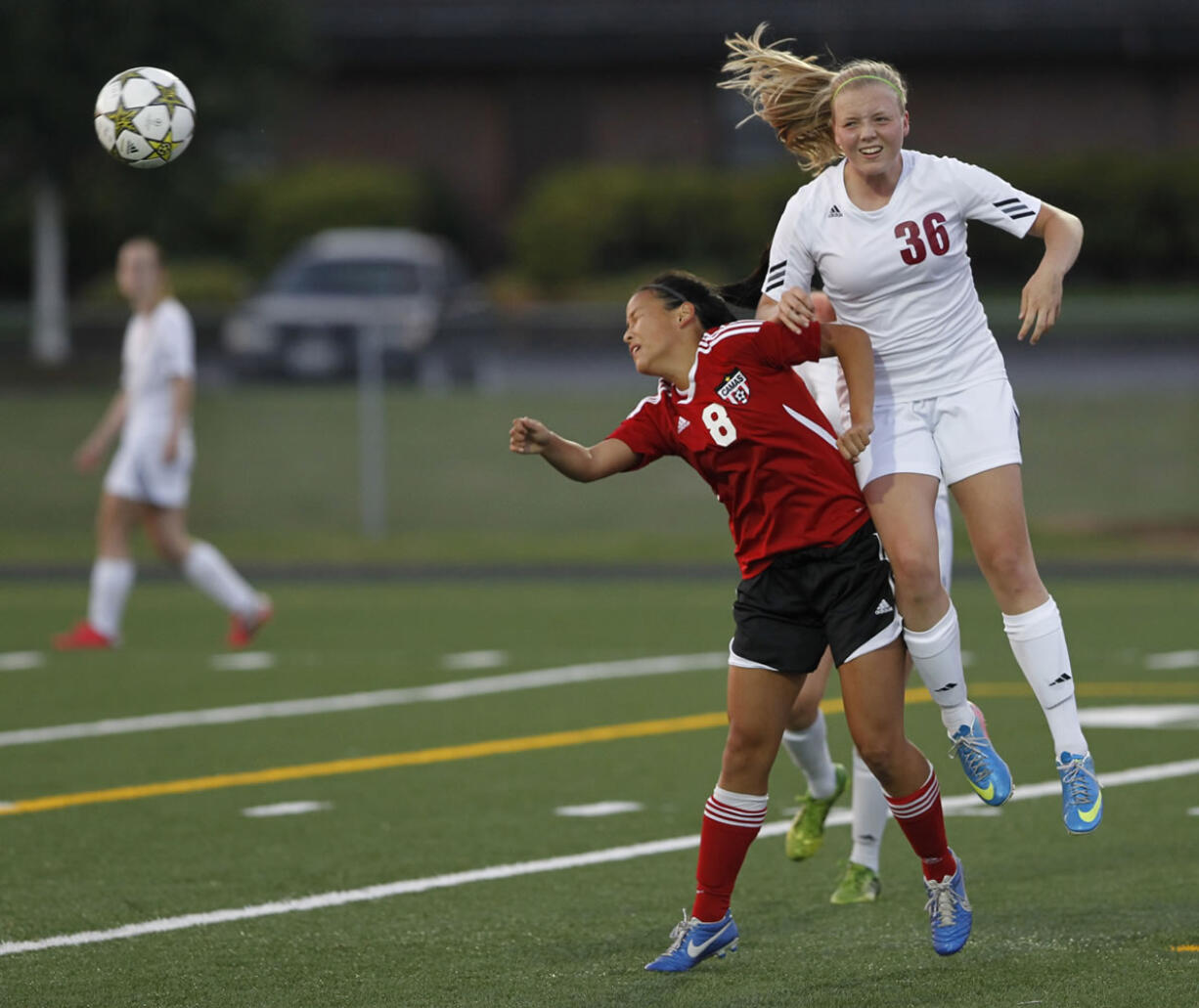 Prairie midfielder Natalie Whitesel (36) and Camas winger Amanda Shi compete for the ball during Camas' 3-0 non-league victory over the Falcons on Tuesday.