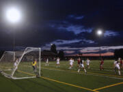 The Prairie and Camas girls soccer teams play the first night match under the newly installed lights at Prairie High School's on-campus field.