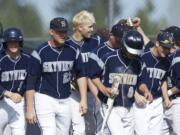 Skyview baseball player Brayden Maney is congratulated by teammates after he hit a grand slam in the league finale Friday against Heritage.