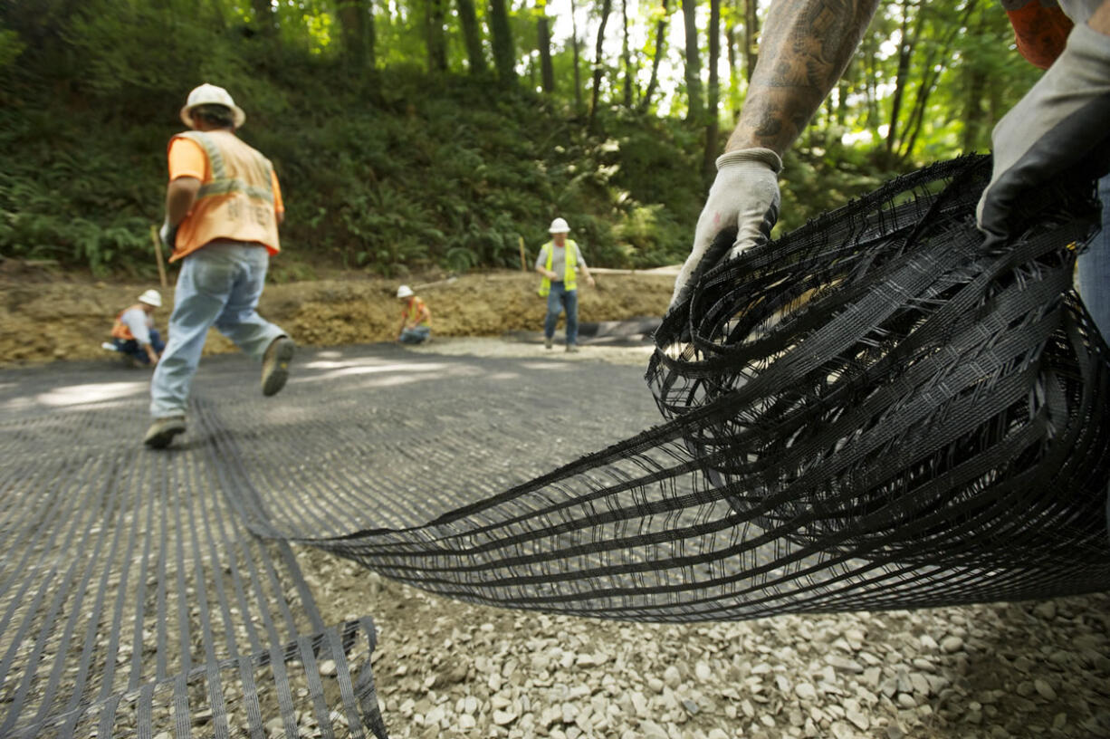 Construction crews are using a &quot;deep patch&quot; technique to rebuild the foundation under a section of Northwest Pacific Highway outside La Center.