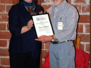 Esther Short: Clark County Historical Society Executive Director Susan Tissot presents the museum's Volunteer of the Year award to Howard Gingold for donating more than 2,000 hours of time in five years.