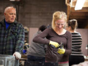 Bagley Downs: Richard Thomas from Vancouver and Woodland High School student Kelly Nigro help recycle computers Nov. 16 at Empower Up, 5000 E.