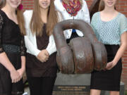 Camas: Liberty Middle School leadership students, from left, Teague Shroeder, Gracen O'Dell, Raegan Moss and Cambryn Gulzow show off the Davy Crockett's anchor, now on the school campus, on Nov.