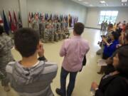 Members of the 915th Forward Surgical Team unit who will soon deploy to Afghanistan pose for pictures during the farewell ceremony at the Army Reserve Center on Saturday.