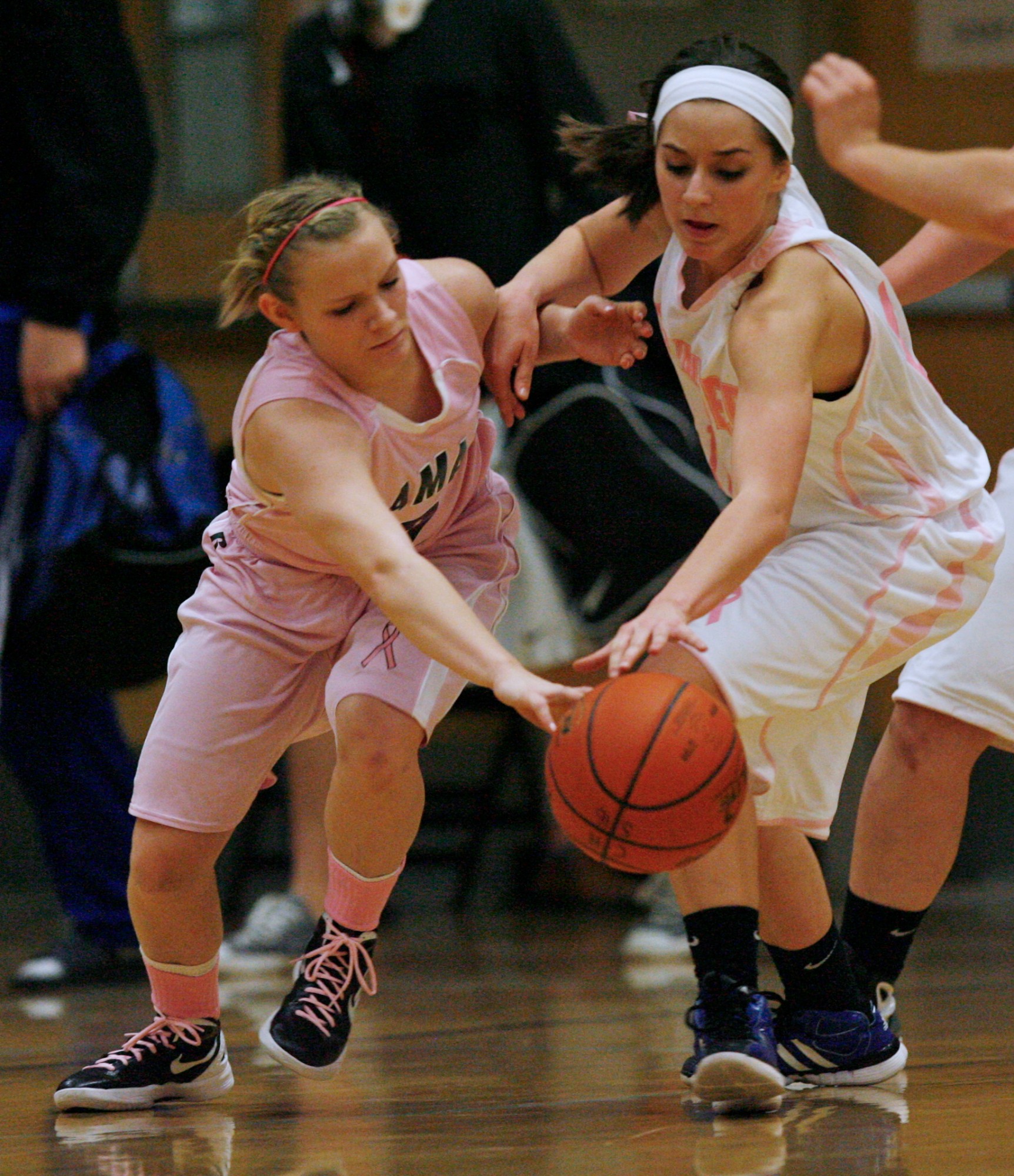 Camas guard Paige Jackson (left) and Mountain View guard Emma DuChesne (right) battle for loose ball during high school basketball action at Camas high school.