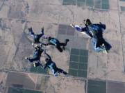 Dustin Weeks and his Air Force Academy team, Air Force Paradigm, competed in formation jumps in the National Collegiate Parachuting Championships.