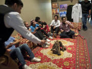 Clark College students sit on traditional cushions as members of the Saudi Student Club offered a glimpse of Saudi culture on Tuesday.