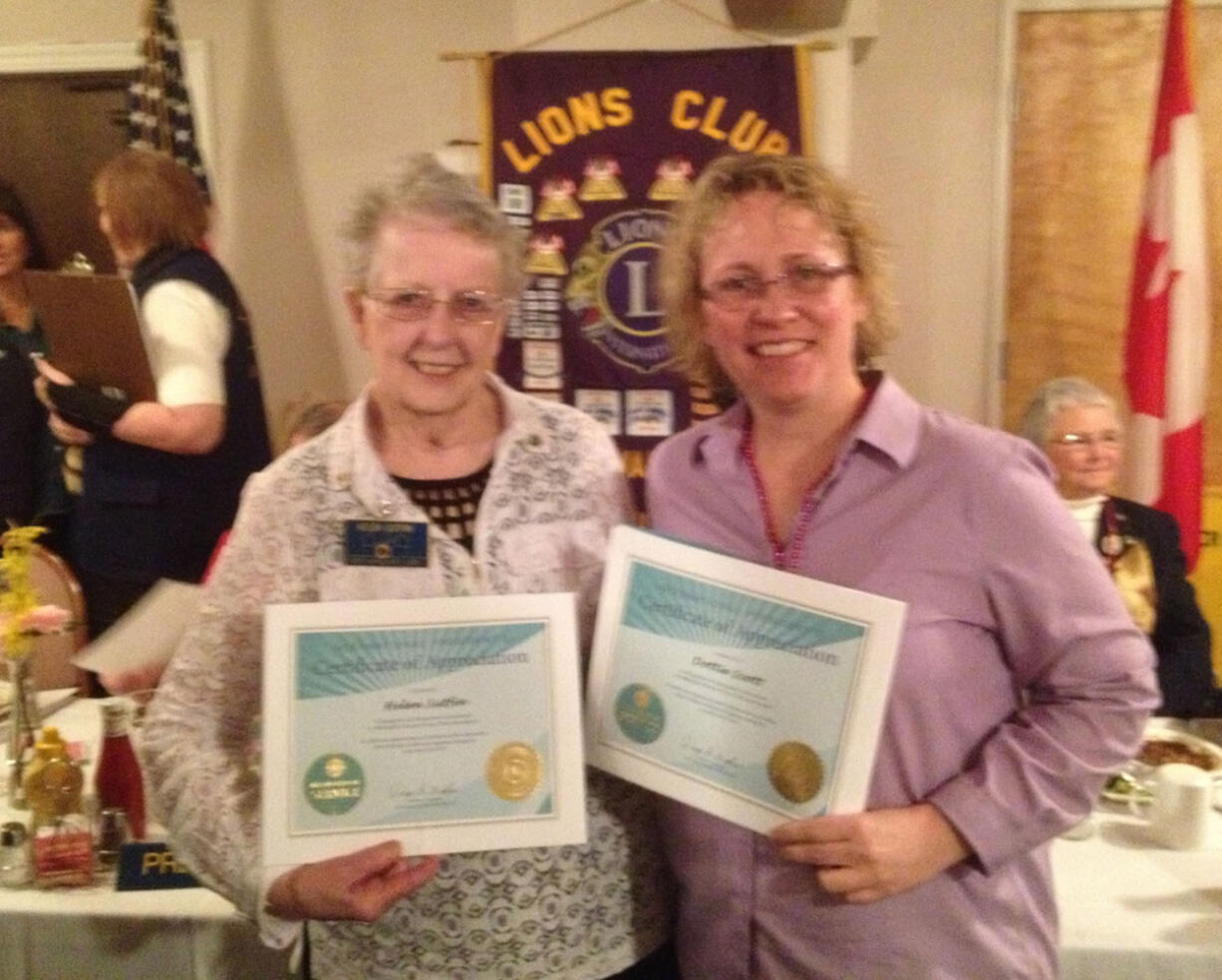 Hudson's Bay: Fort Vancouver Lions Club members Helen Sutfin, left, and Dotty Scott each hold the International President's Certificate of Appreciation that they received at the Multiple District Spring Conference on March 9.