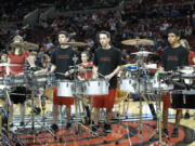 Members of the One of A Kind Drumline get ready to rock at a recent performance.