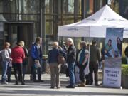 Nearly 100 Clark County residents signed up for more information and follow-up appointments during a Washington Healthplanfinder mobile tour stop at the Vancouver Community Library on Wednesday.