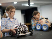 Torie Brockbank, 10, prepares to race her pumpkin, called ZB, at the Screaming Pumpkin Derby.