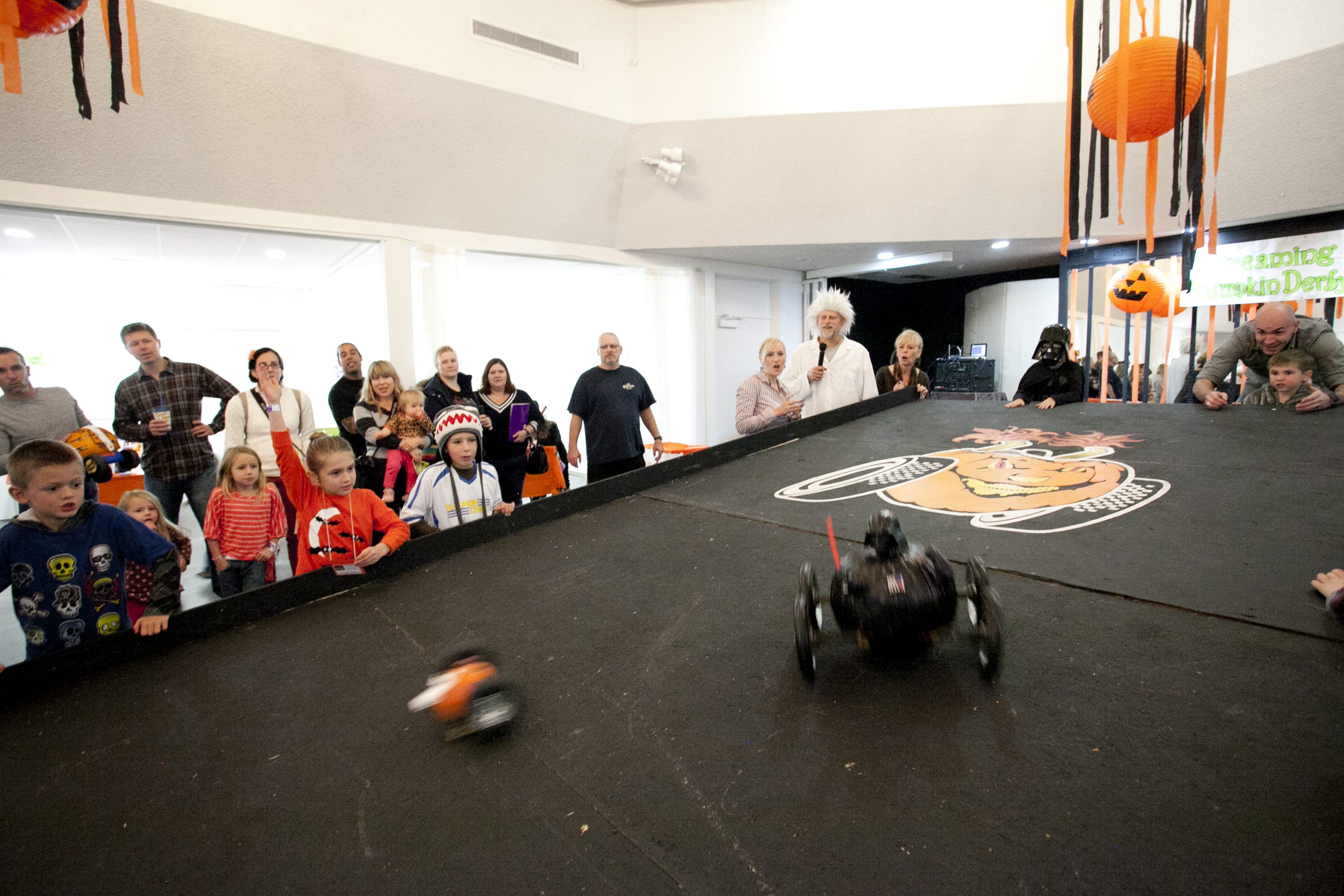 Kids rolled a variety of pumpkin-cars down a large ramp at the third annual Screaming Pumpkin Derby.