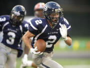 Jacob Dennis, 2, of Skyview High School scores a touchdown on a pass play against Lakes High School in a game at Kiggins Bowl Friday September 14, 2012.