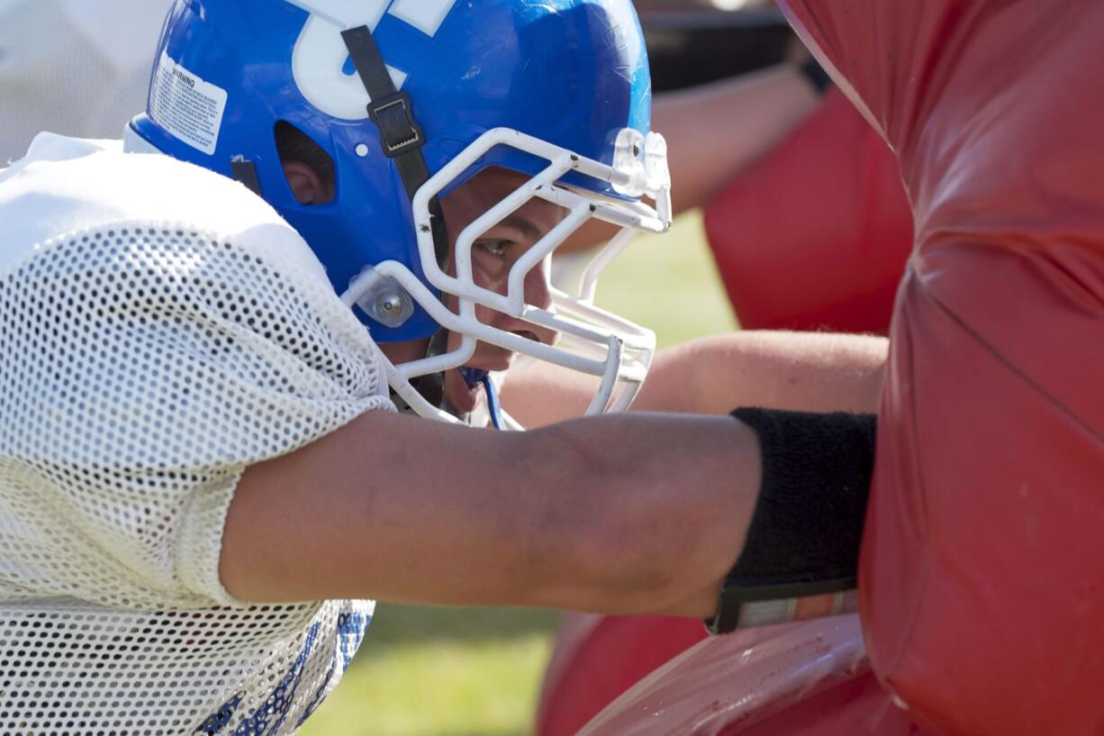 La Center High School lineman Levi Krout takes part in practice drills.