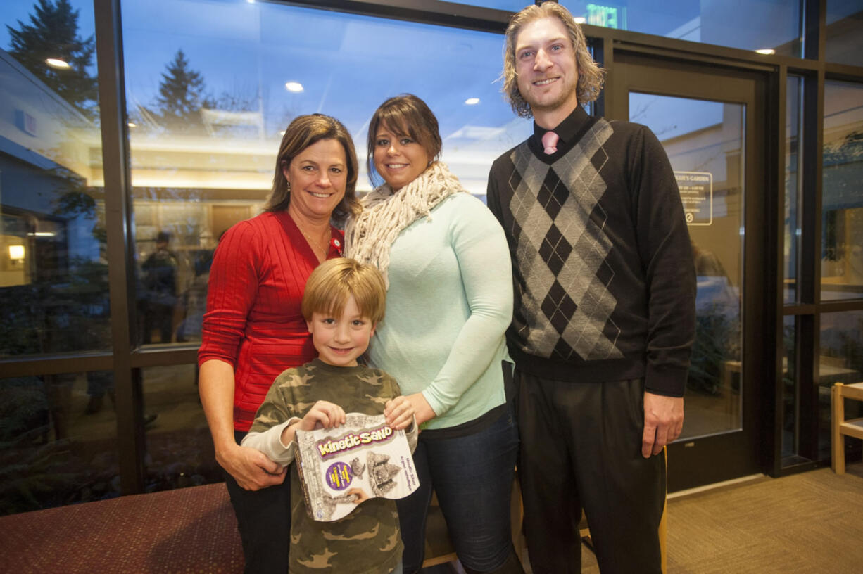 Harlan Boline, 5, who was born at the neonatal intensive care unit at PeaceHealth Southwest Medical Center, poses with the nurse who cared for him while he was there, Cyndi Callahan, left, and his parents, Cali Jo and Gabe on Friday.