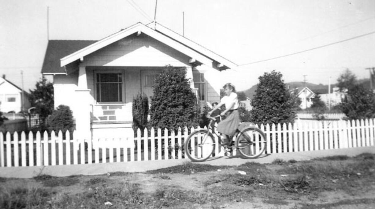 Carol Rose rides her bike near her Aberdeen house in the heyday of drive-in theaters.