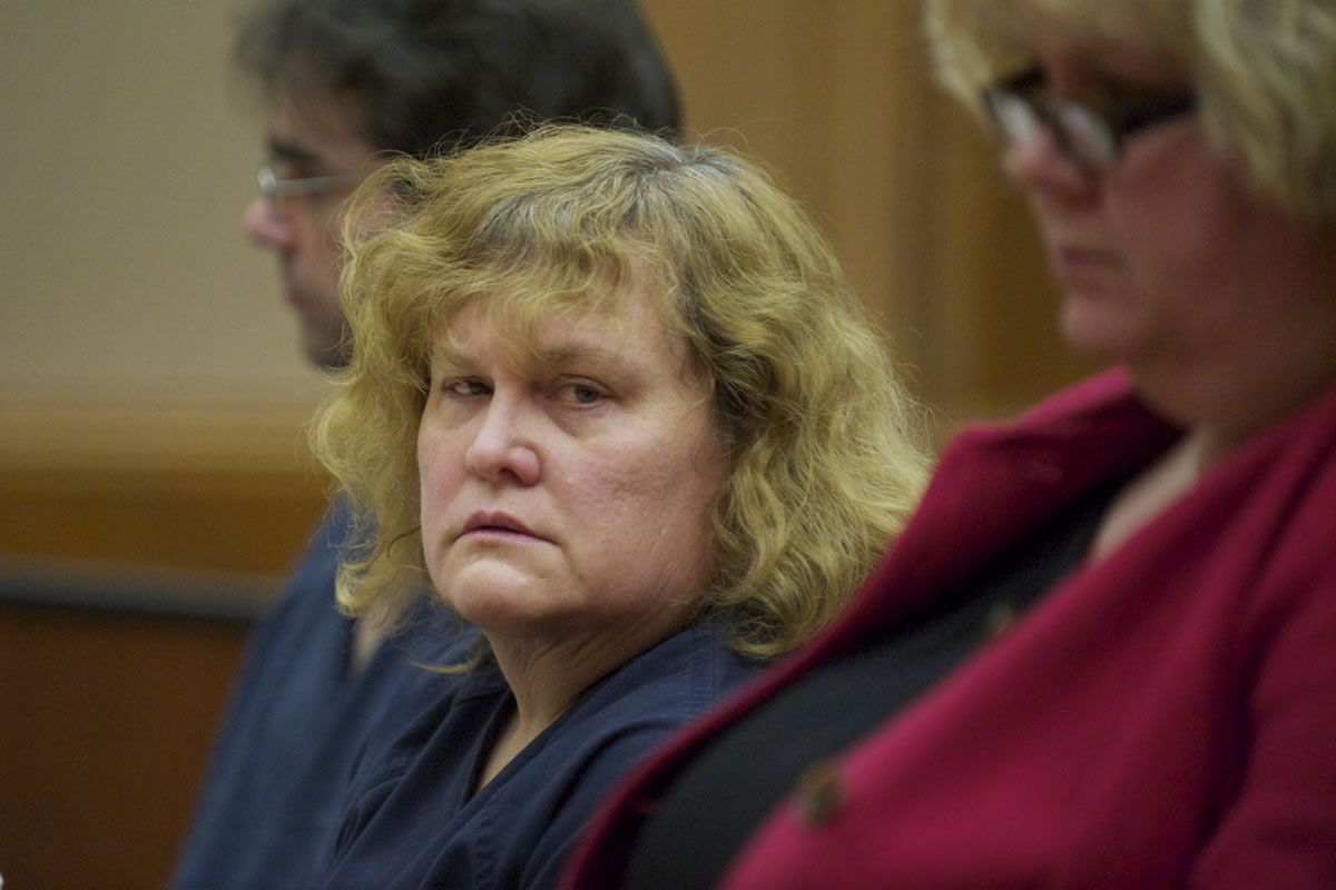 Sandra Weller reacts after sentencing by Judge Barbara Johnson on Wednesday, March after being convicted last month of starving and beating their adopted twins.