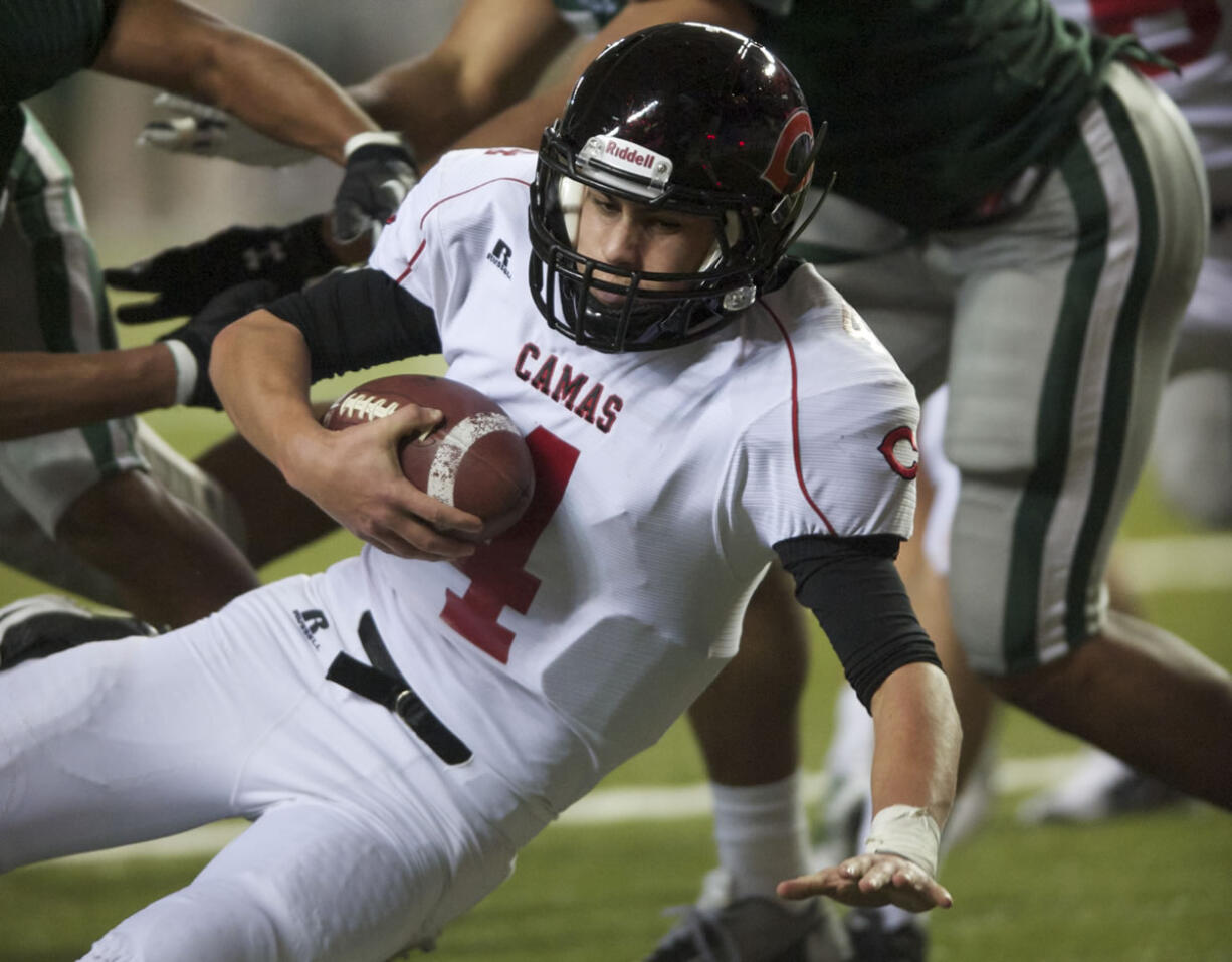 Camas quarterback Reilly Hennessey runs the ball in to the end zone to close the gap to 21-44 in the second half against Skyline in a 4A semifinal match-up at the Tacoma Dome on Saturday November 24, 2012. Skyline won the game 51-28.