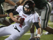 Camas quarterback Reilly Hennessey runs the ball in to the end zone to close the gap to 21-44 in the second half against Skyline in a 4A semifinal match-up at the Tacoma Dome on Saturday November 24, 2012. Skyline won the game 51-28.