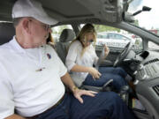 Lee Tangen, left, a driving trainer, works with student Corrina Gensitskiy, 17.