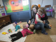 Kaylin Tompkins and her four children in the basement of a family she knows through Facebook Wednesday November 4 , 2015. The 29-year-old supports her family on $600 in welfare and $400 in EBT every month. She's trying to find more permanent housing until her fiancé is released from prison.