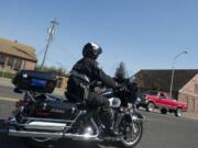 Battle Ground police officer Shaun Holahan patrols the streets from a Harley Davidson motorcycle on Friday.