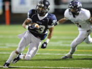 Skyview's Forrest Russell runs with the ball during a 4A playoff game last season against Issaquah